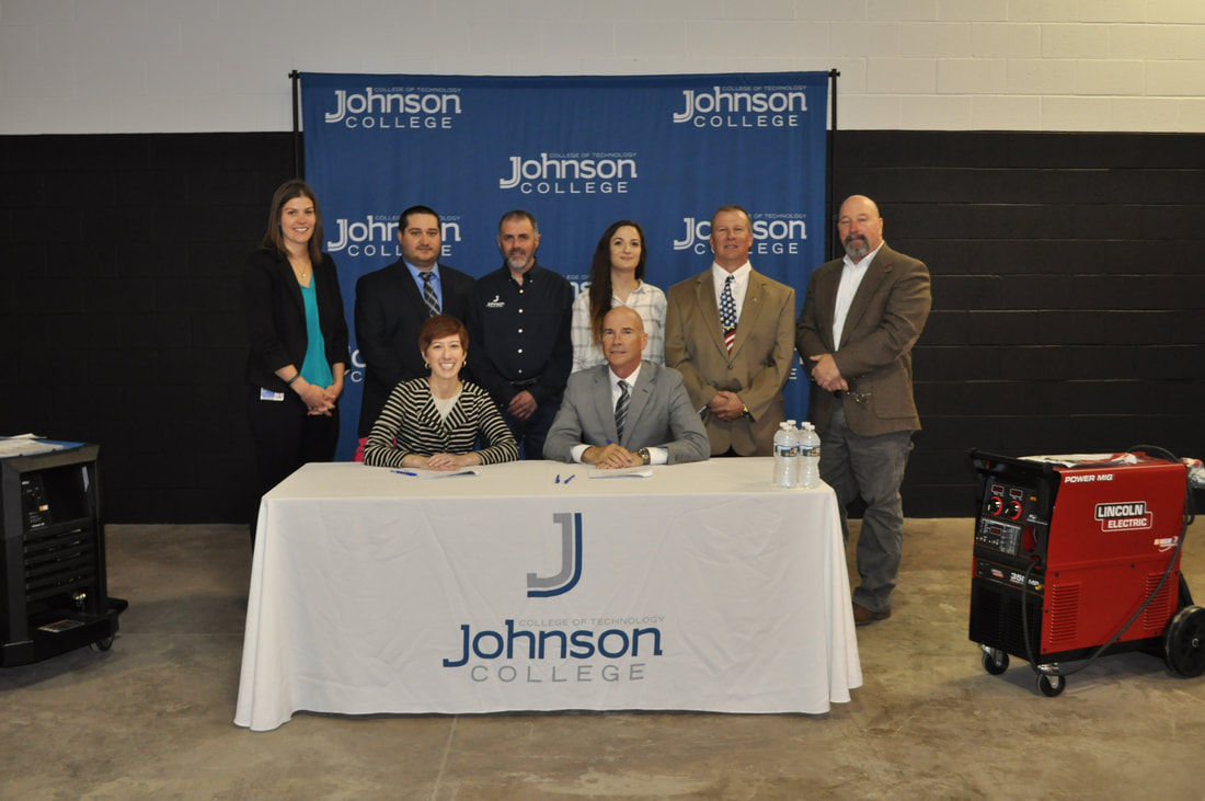 Signing at Johnson College